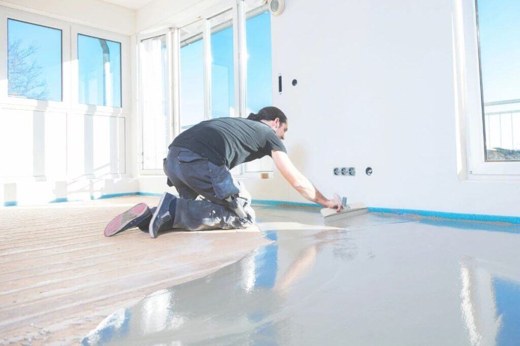 Perth Epoxy Group worker applying Residential Epoxy Flooring in Parmelia home